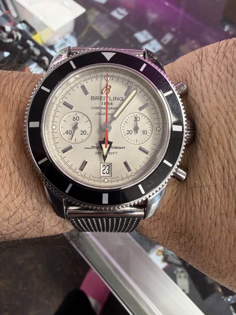 2012-2013 Breitling Superocean Heritage Chronograph A23370 — 44mm, stainless steel, silver dial, black bezel, on the mesh bracelet 2715/154A