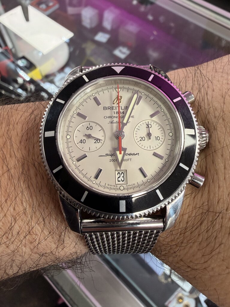 2012-2013 Breitling Superocean Heritage Chronograph A23370 — 44mm, stainless steel, silver dial, black bezel, on the mesh bracelet 2715/154A