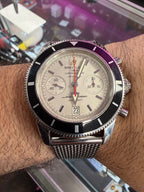 2012-2013 Breitling Superocean Heritage Chronograph A23370 — 44mm, stainless steel, silver dial, black bezel, on the mesh bracelet 2715/154A