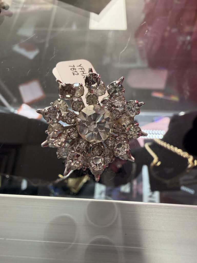 Silver toned Vintage Starburst or Snowflake Brooch with Clear Rhinestones