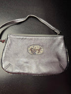 Sharif Metallic Silver Wristlet