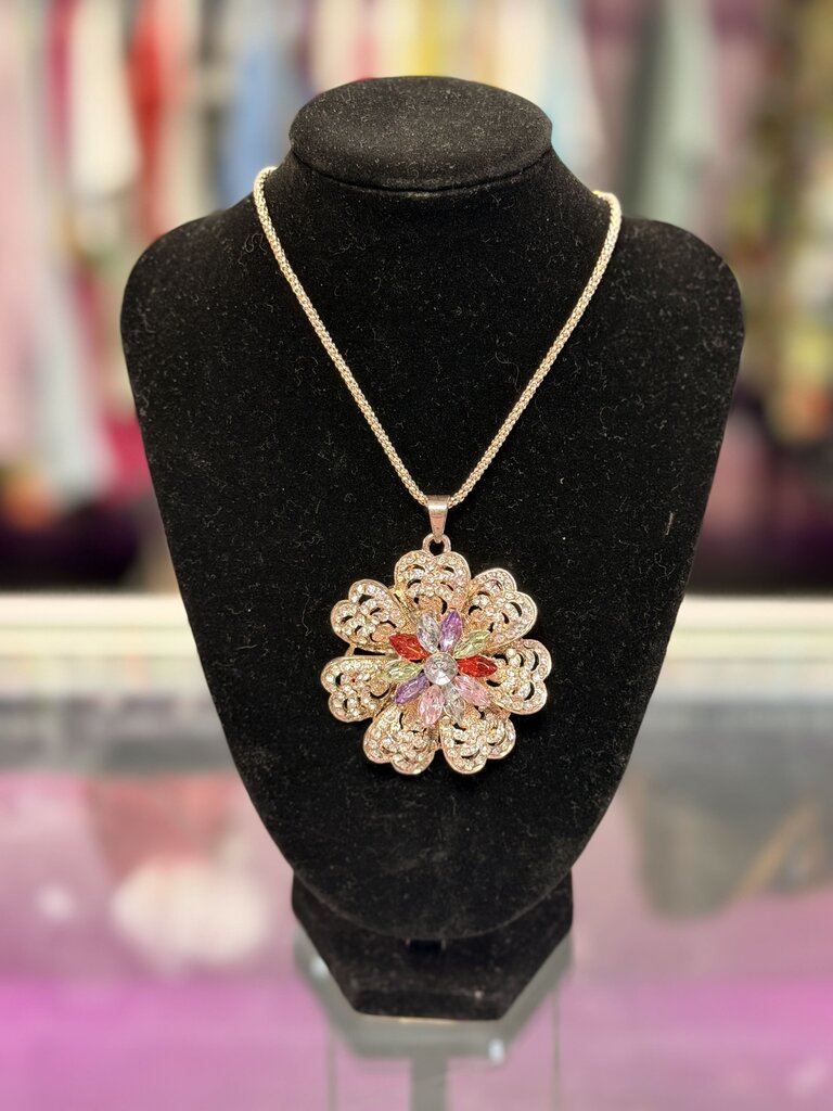 Betsey Johnson Long Necklace features Large Crystal accented Flower Pendant