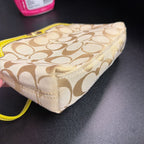 Coach Signature Jacquard Turnlock Mini Wristlet Bag